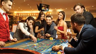 Gamblers playing on a European roulette table.