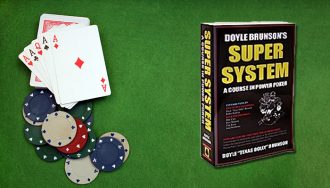 Super System by Doyle Brunson, poker cards and chips