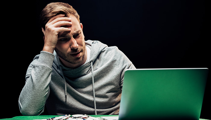 A visibly-frustrated Gambler Playing Game at an Online Casino