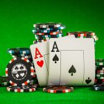 Poker chips and pair of aces