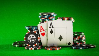 Poker chips and pair of aces