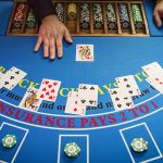 An image depicting a blackjack table with cards