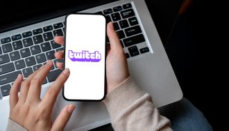 The Twitch Gambling App Opened on a Phone on Top of a Laptop