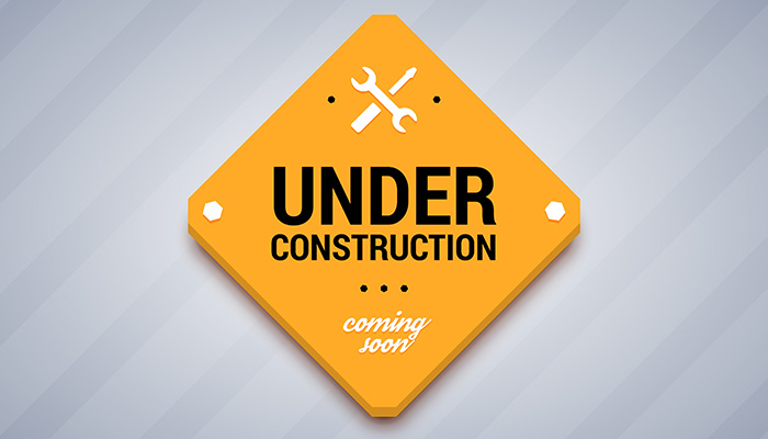 Yellow Sign Saying Under Construction and Coming Soon