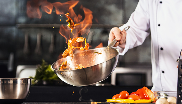 Chef Cooking in Kitchen