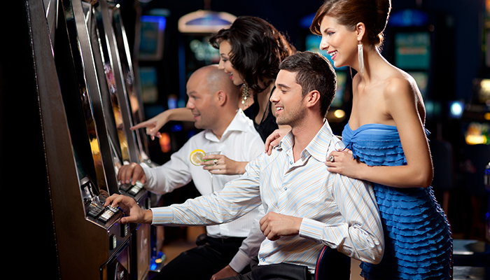 Gamblers Playing Slots in Casino