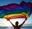 Rainbow Flag Being Waved by Person