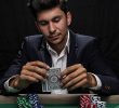 Man in suit playing poker