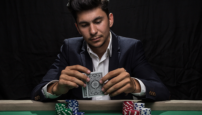 Man in suit playing poker