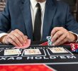 Poker player at a table with chips and cards