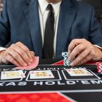 Poker player at a table with chips and cards