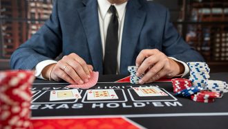 Poker player at a table with chips and cards