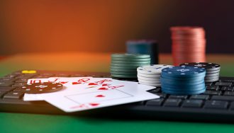 Computer keyboard with poker chips and cards