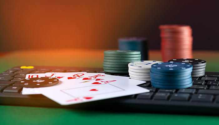 Computer keyboard with poker chips and cards